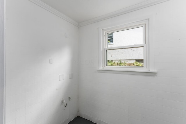 unfurnished room featuring ornamental molding