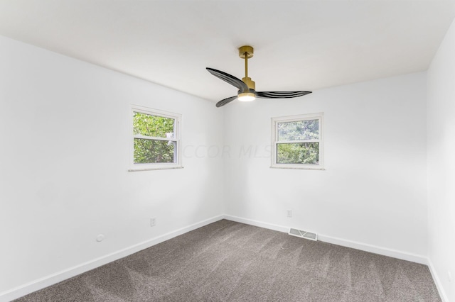 unfurnished room with ceiling fan and carpet floors