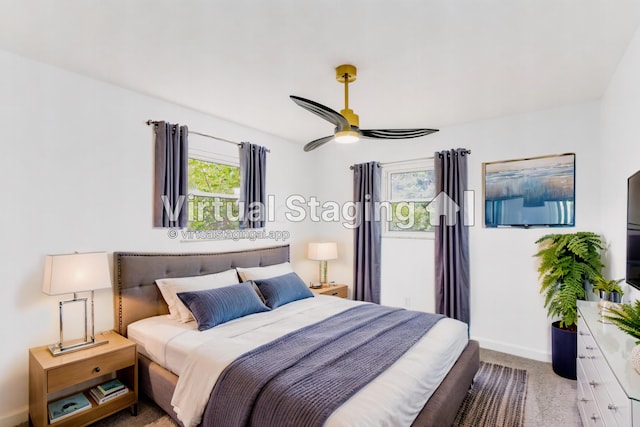 carpeted bedroom with ceiling fan