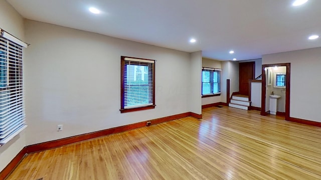 unfurnished room with light hardwood / wood-style flooring