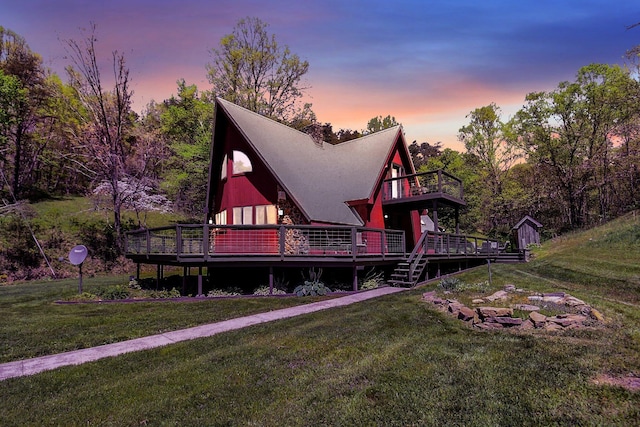 exterior space featuring a deck and a lawn