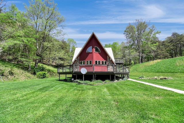 back of property with a lawn