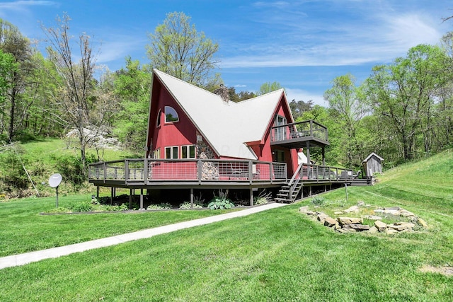 back of house featuring a yard and a deck