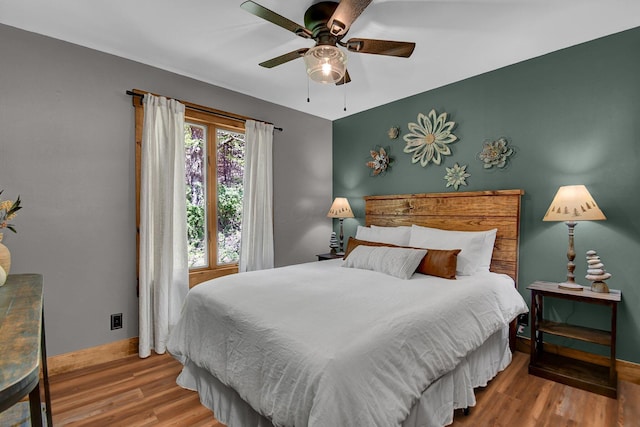 bedroom featuring ceiling fan and hardwood / wood-style flooring