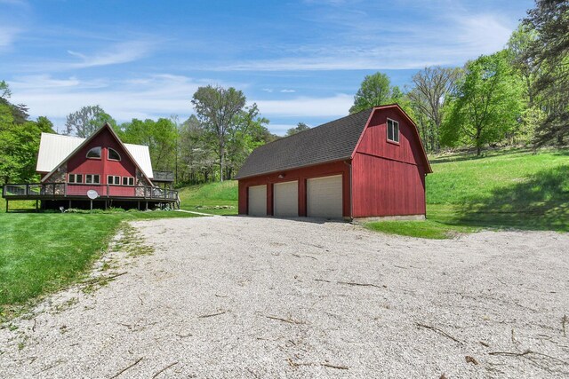 view of outbuilding featuring a yard and a garage