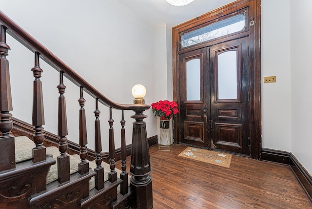 foyer entrance with dark hardwood / wood-style flooring