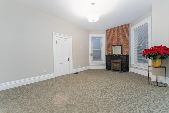 living room featuring a large fireplace