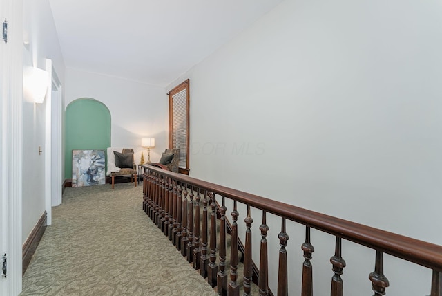 corridor with light colored carpet