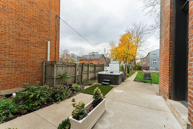 view of patio featuring a hot tub