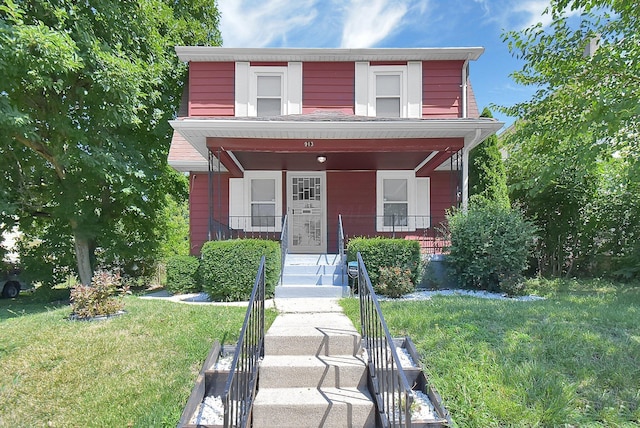 view of front of property featuring a porch and a front lawn