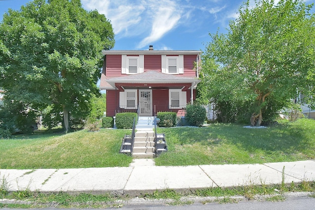 view of front of house featuring a front lawn and a porch