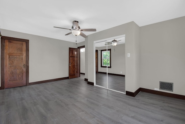 empty room featuring light wood-type flooring and ceiling fan