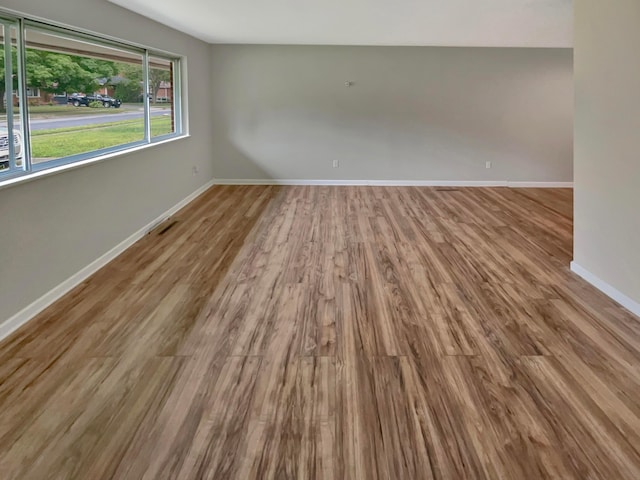 unfurnished room featuring light wood-type flooring