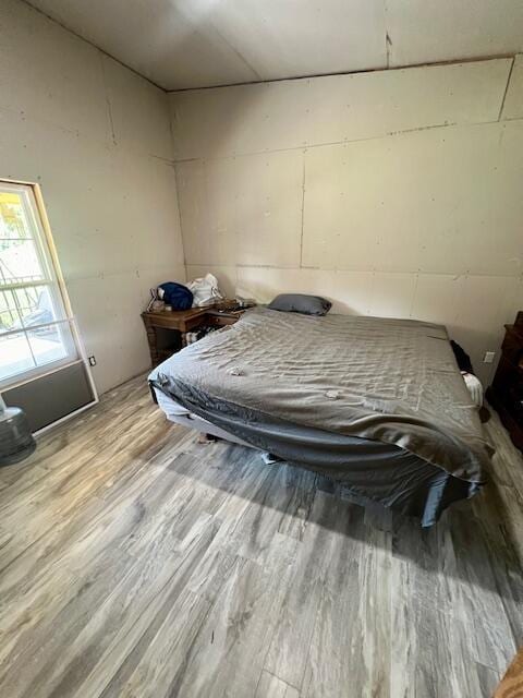 unfurnished bedroom featuring light wood-type flooring