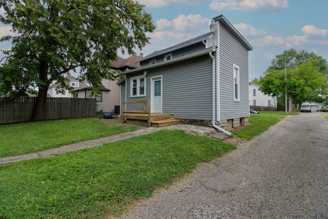 back of house with a yard