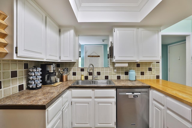 kitchen featuring white cabinets, decorative backsplash, stainless steel dishwasher, and sink