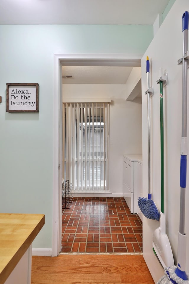 doorway to outside featuring separate washer and dryer