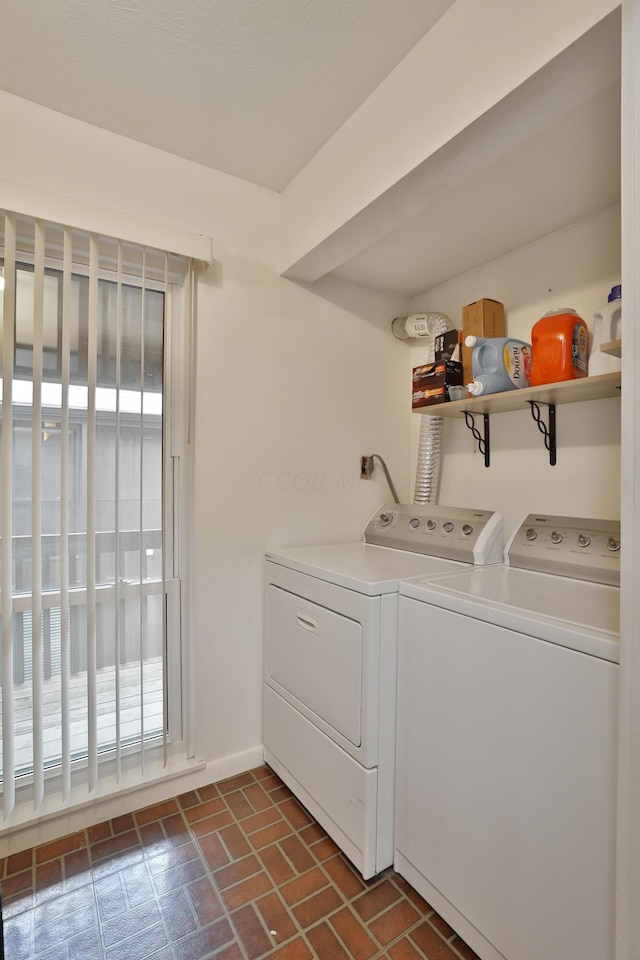 washroom featuring washer and dryer and plenty of natural light