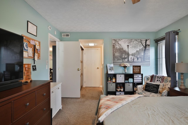 carpeted bedroom with a textured ceiling