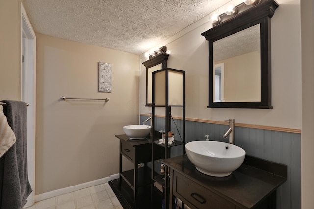 bathroom featuring vanity and a textured ceiling