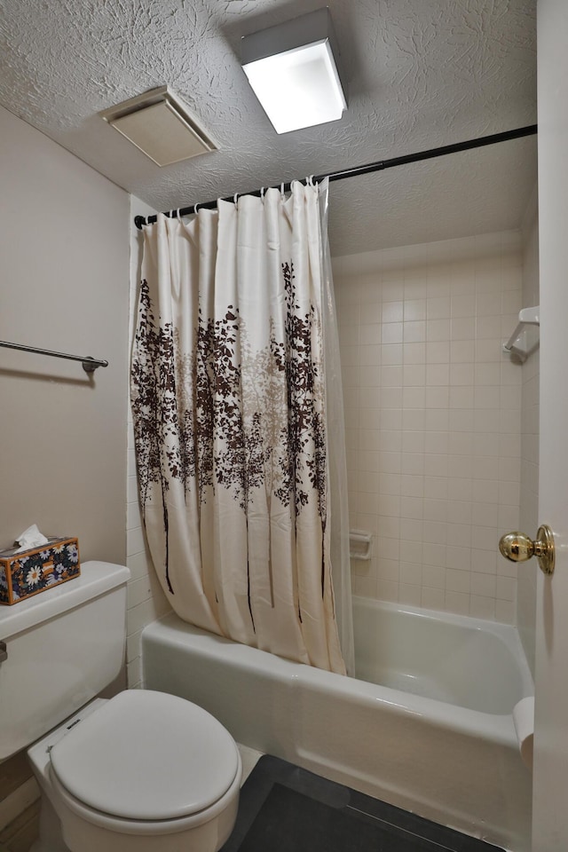 bathroom featuring shower / bathtub combination with curtain, a textured ceiling, and toilet