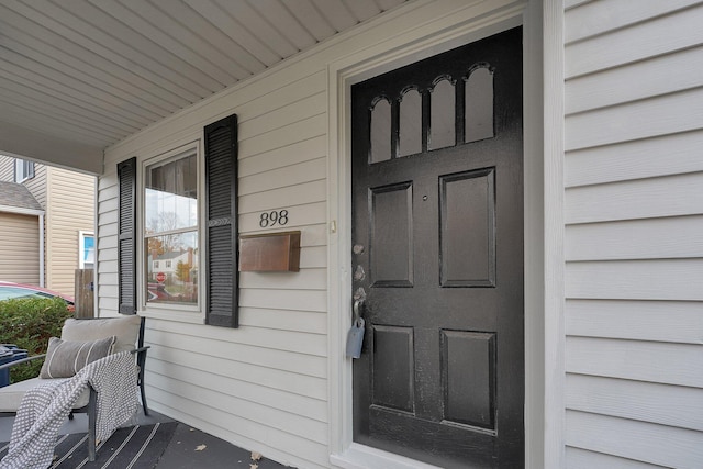 doorway to property with a porch