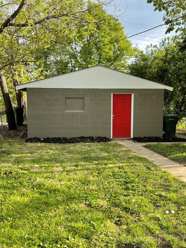 view of outdoor structure with a lawn