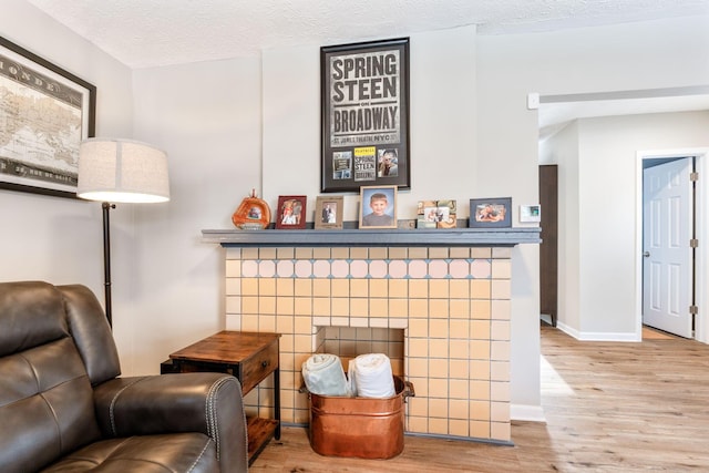 details featuring hardwood / wood-style flooring and a textured ceiling