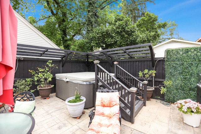 view of patio / terrace featuring a hot tub