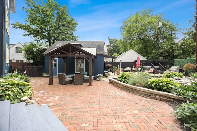 view of patio / terrace featuring an outdoor living space and a gazebo