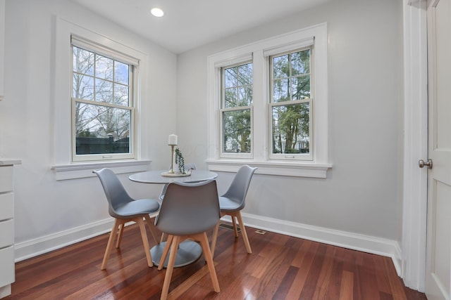 dining room with dark wood-type flooring