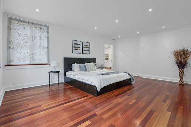 bedroom featuring dark hardwood / wood-style floors