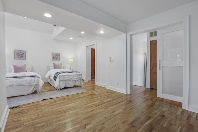 bedroom with hardwood / wood-style floors