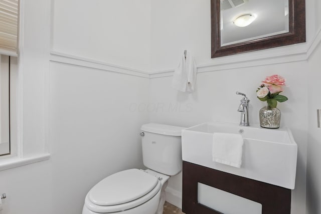 bathroom with vanity and toilet