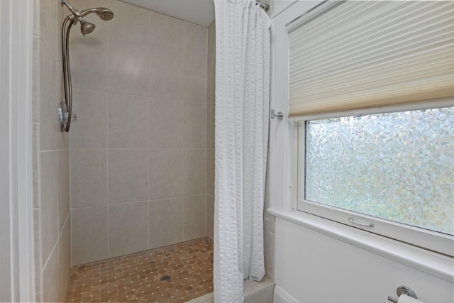 bathroom featuring a shower with curtain