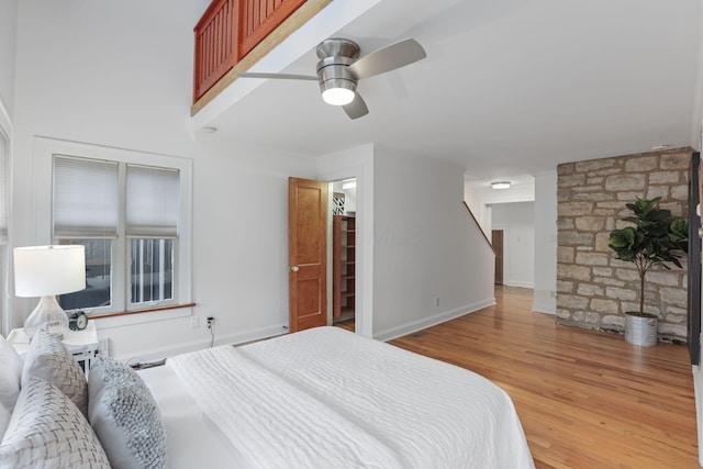 bedroom with hardwood / wood-style flooring and ceiling fan