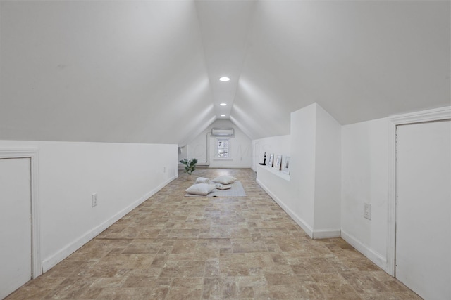 additional living space featuring lofted ceiling