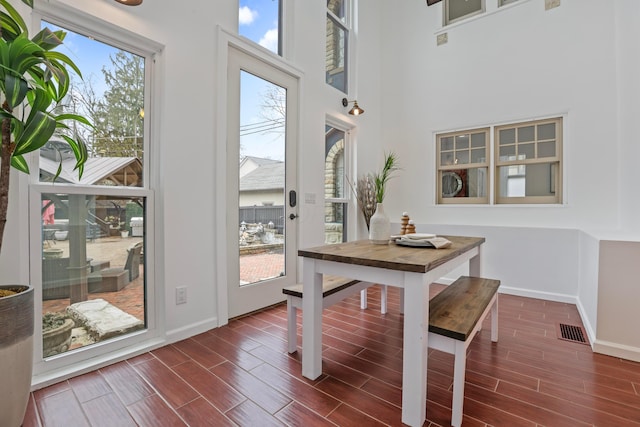 dining area with a high ceiling