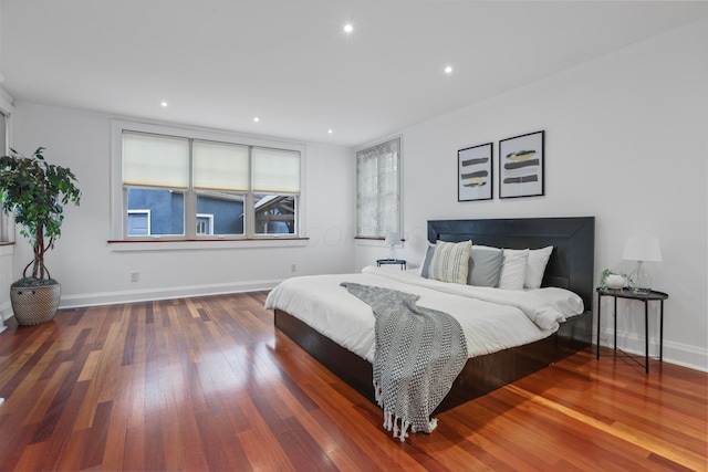 bedroom with wood-type flooring