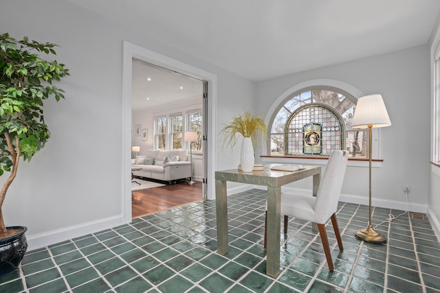 dining area with dark hardwood / wood-style flooring