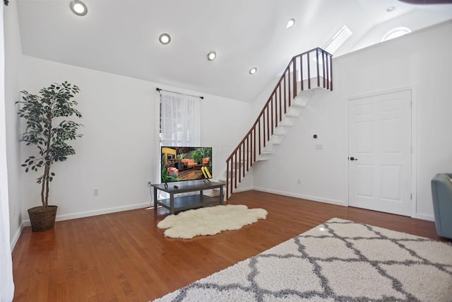 interior space with lofted ceiling and dark hardwood / wood-style flooring