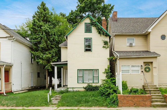 view of front of home with a front lawn