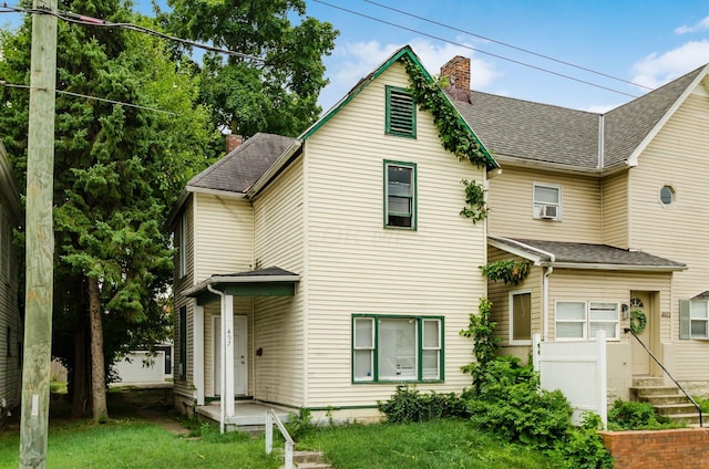 view of front of home featuring cooling unit