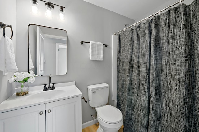 bathroom with a shower with curtain, vanity, toilet, and wood-type flooring