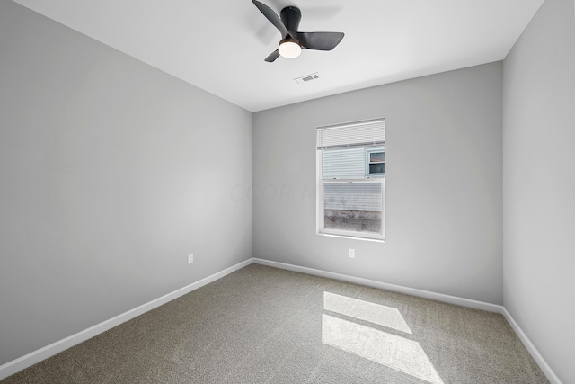 unfurnished room with ceiling fan and carpet floors