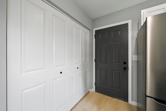 doorway with light hardwood / wood-style flooring