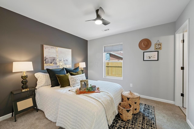 bedroom featuring light carpet and ceiling fan