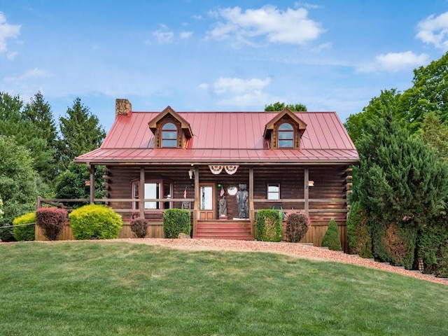 log cabin featuring a front yard and a porch