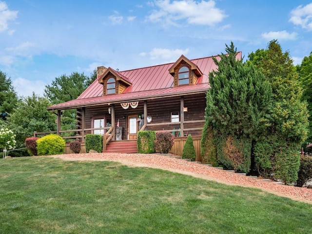 log-style house featuring a front yard and a porch