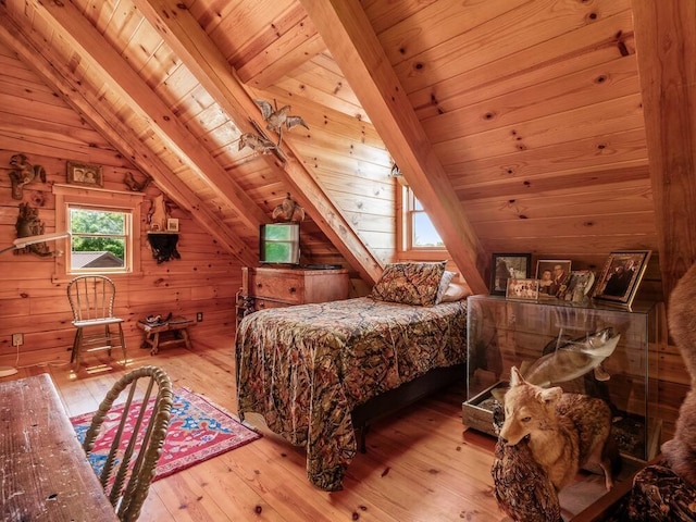 bedroom featuring wood walls, light wood-type flooring, lofted ceiling, and wood ceiling